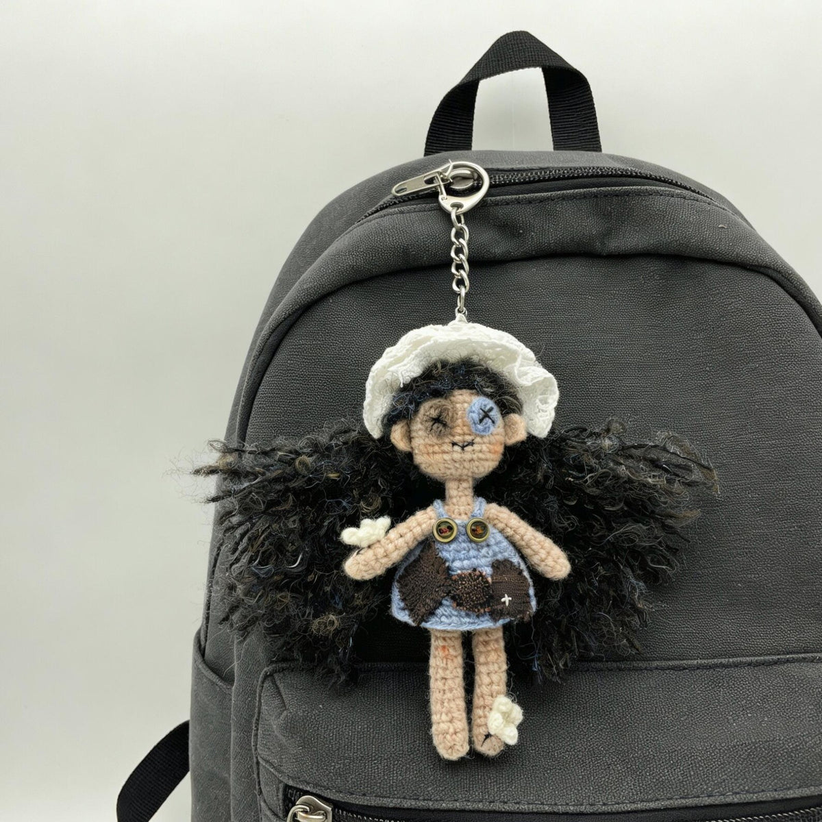 Artisan knit maiden figurines, imaginative ornamental pieces, purse‑hung trinkets, hobbyist‑oriented mementos, Yuletide wearable adornment