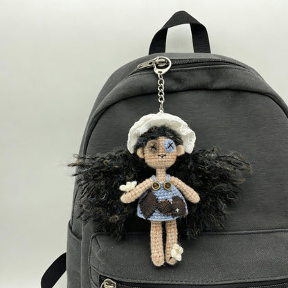Artisan knit maiden figurines, imaginative ornamental pieces, purse‑hung trinkets, hobbyist‑oriented mementos, Yuletide wearable adornment
