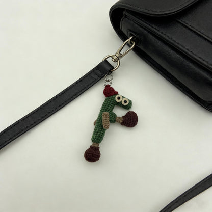 Artisan woven letter F charm imaginative ornamental memento sack adornment personalized initial dangling trinket Yuletide seasonal treasure