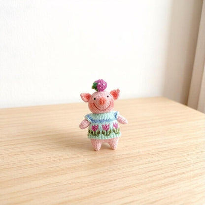 Artisan knit piglet sculpted pieces, yarn crafted statuettes, one-of-a-kind hobbyist souvenirs, household adornments, Yuletide indoor trims