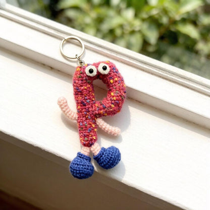 Artisan knit alphabet P figurine charm, imaginative alphabet token, handbag adornment, multihued letter ornament, Yuletide display trim