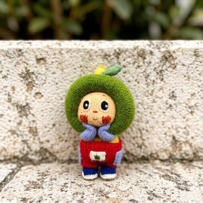 Artisan knit green apple figurine, nursery ornamental piece, birthday milestone memento, hobbyist showcase treasure, Yuletide home adornment
