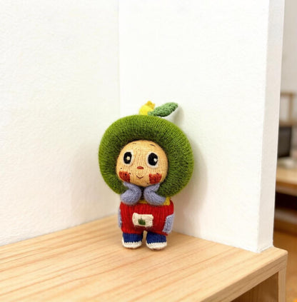 Artisan knit green apple figurine, nursery ornamental piece, birthday milestone memento, hobbyist showcase treasure, Yuletide home adornment