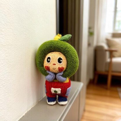 Artisan knit green apple figurine, nursery ornamental piece, birthday milestone memento, hobbyist showcase treasure, Yuletide home adornment