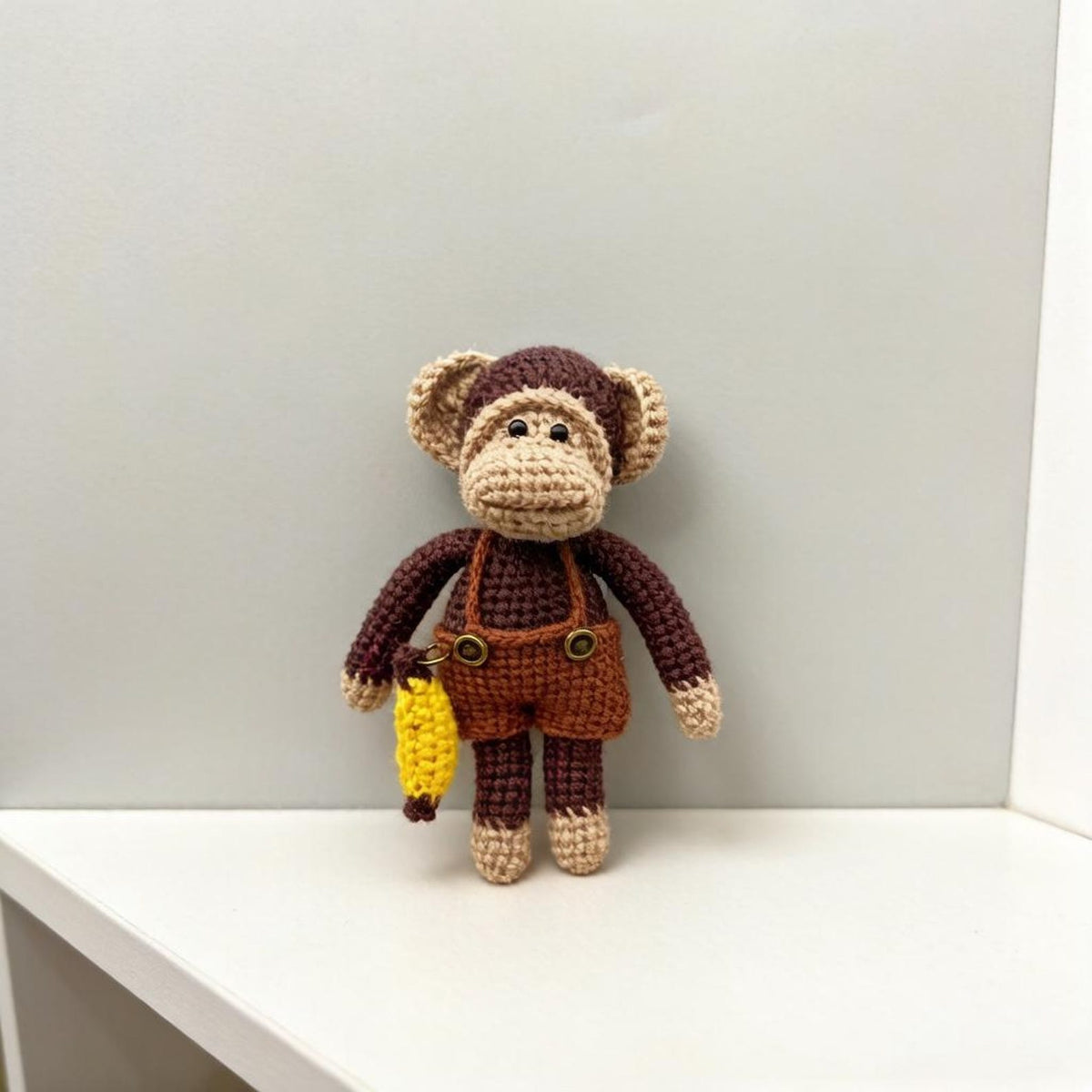 Artisan woven banana primate statuette, juvenile memento, infant gathering adornment, hobbyist display sculpture, Yuletide playroom trim