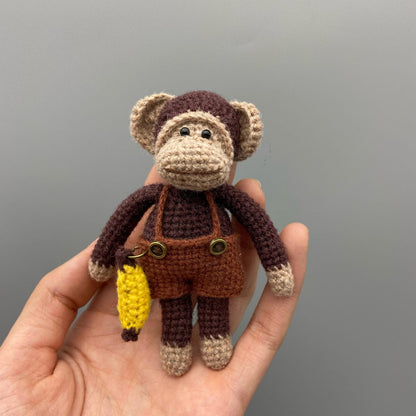 Artisan woven banana primate statuette, juvenile memento, infant gathering adornment, hobbyist display sculpture, Yuletide playroom trim