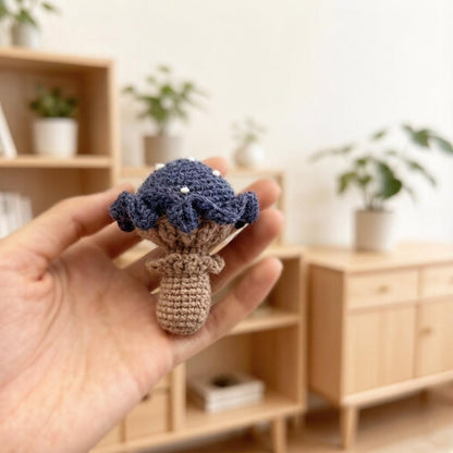 Artisan knit fungus sculptures, imaginative seasonal favors, purse adornments, keyring trinkets, display tokens, Yuletide interior decor