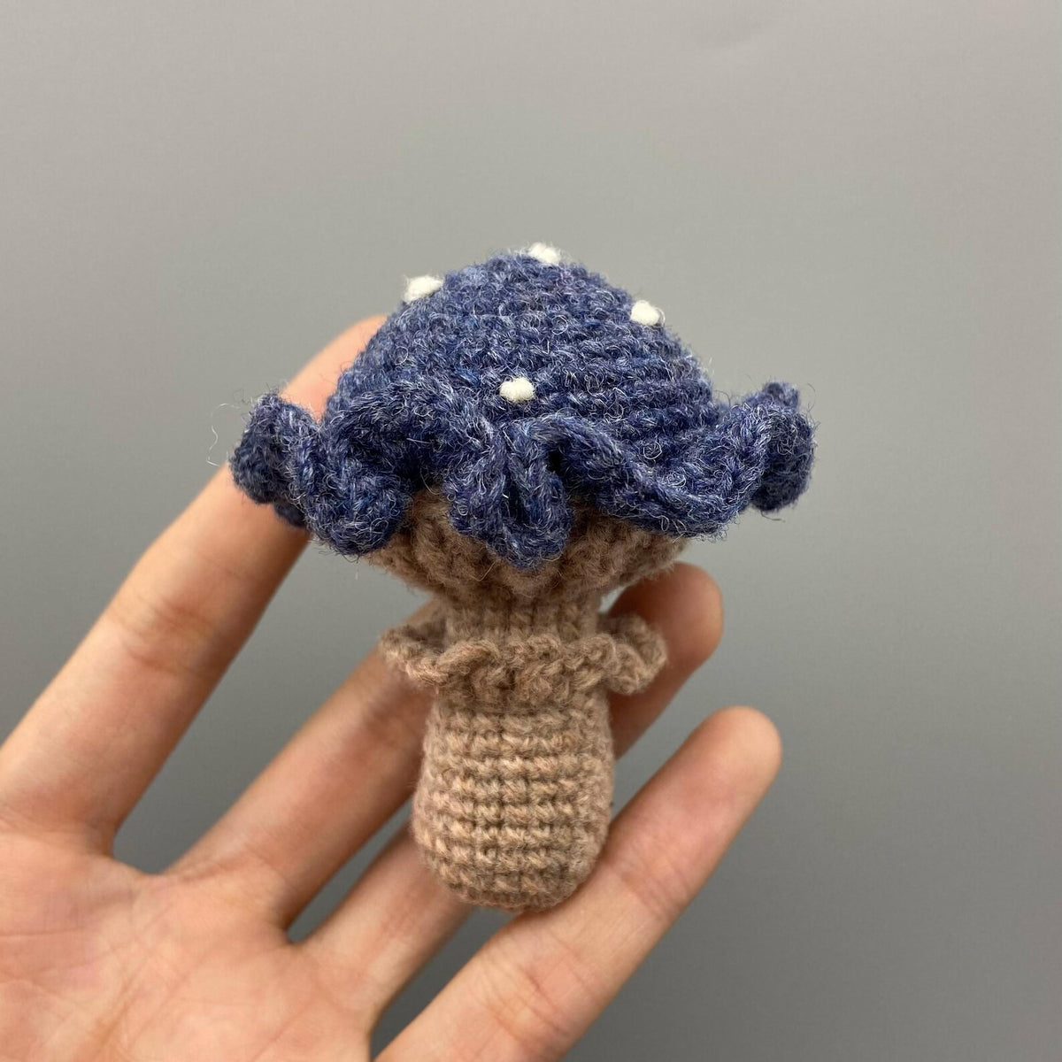 Artisan knit fungus sculptures, imaginative seasonal favors, purse adornments, keyring trinkets, display tokens, Yuletide interior decor