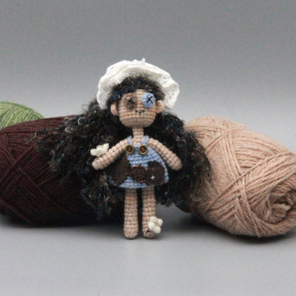 Artisan knit maiden figurines, imaginative ornamental pieces, purse‑hung trinkets, hobbyist‑oriented mementos, Yuletide wearable adornment