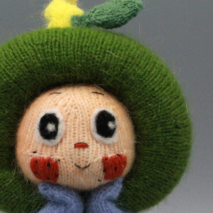 Artisan knit green apple figurine, nursery ornamental piece, birthday milestone memento, hobbyist showcase treasure, Yuletide home adornment