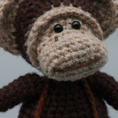 Artisan woven banana primate statuette, juvenile memento, infant gathering adornment, hobbyist display sculpture, Yuletide playroom trim