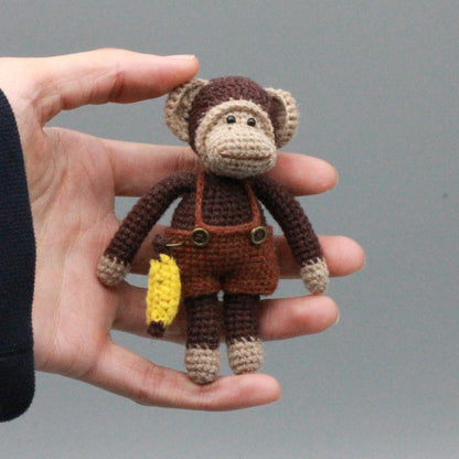 Artisan woven banana primate statuette, juvenile memento, infant gathering adornment, hobbyist display sculpture, Yuletide playroom trim