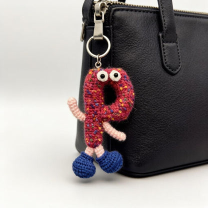 Artisan knit alphabet P figurine charm, imaginative alphabet token, handbag adornment, multihued letter ornament, Yuletide display trim