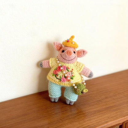Artisan knit piglet sculpted piece, tabletop adornments, pocket carry figurines, hobbyist display statuettes, Yuletide table accents