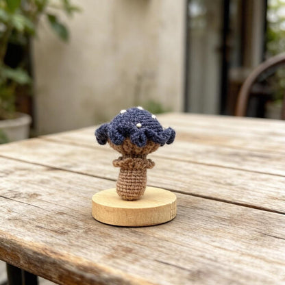 Artisan knit fungus sculptures, imaginative seasonal favors, purse adornments, keyring trinkets, display tokens, Yuletide interior decor