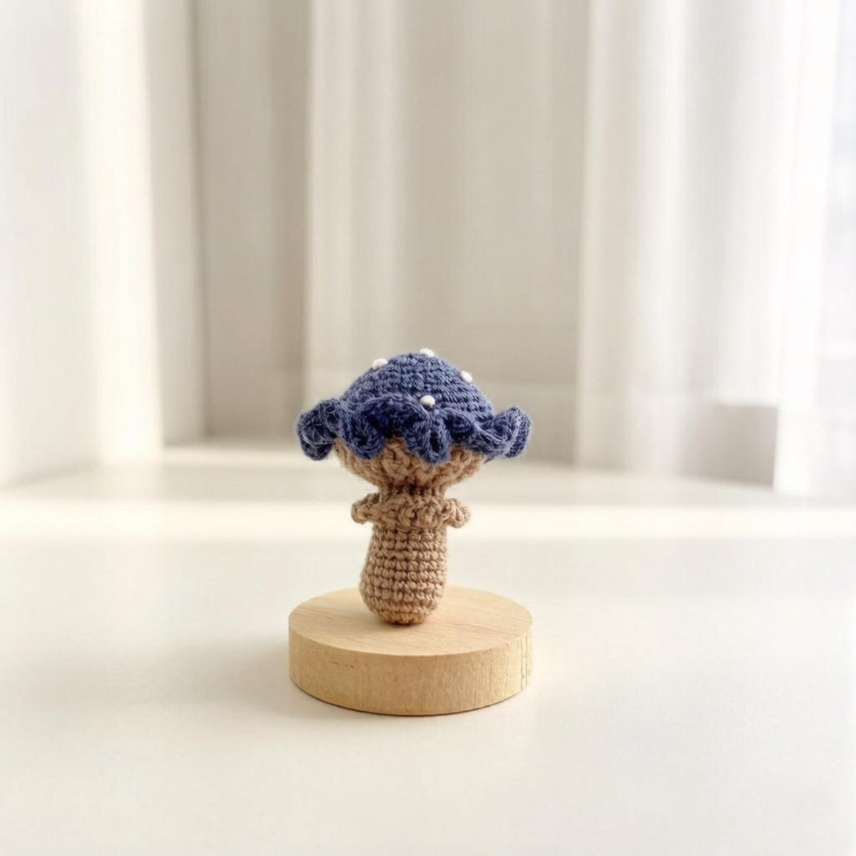 Artisan knit fungus sculptures, imaginative seasonal favors, purse adornments, keyring trinkets, display tokens, Yuletide interior decor