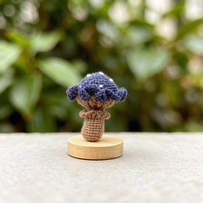 Artisan knit fungus sculptures, imaginative seasonal favors, purse adornments, keyring trinkets, display tokens, Yuletide interior decor