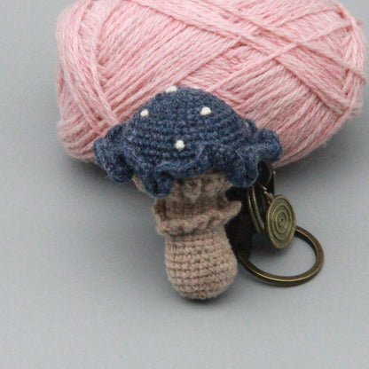 Artisan knit fungus sculptures, imaginative seasonal favors, purse adornments, keyring trinkets, display tokens, Yuletide interior decor