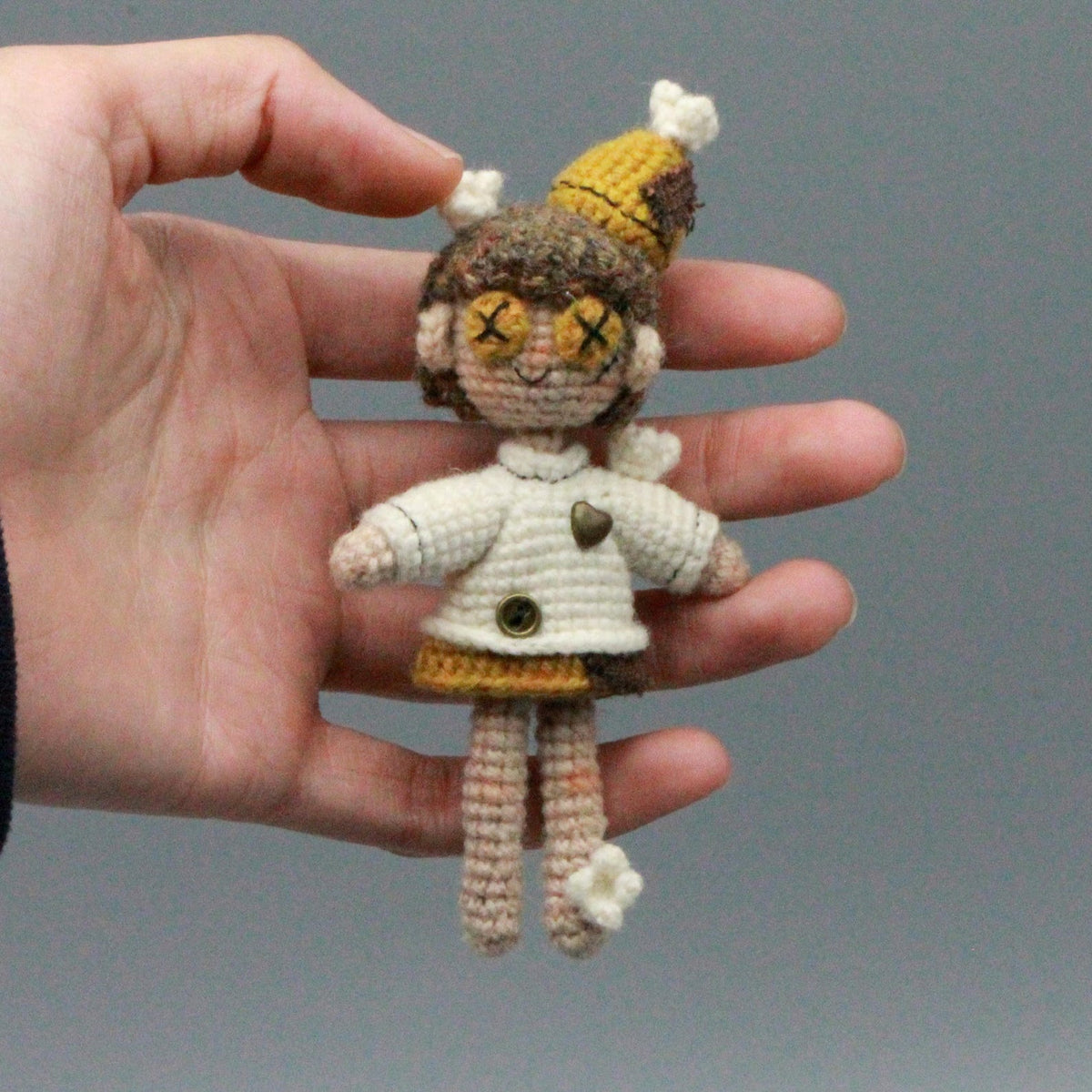 Artisan micro‑crochet maiden figurine, imaginative table‑top ornamental piece, hobbyist showcase sculpture, Yuletide home adornment