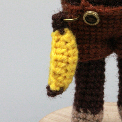 Artisan woven banana primate statuette, juvenile memento, infant gathering adornment, hobbyist display sculpture, Yuletide playroom trim