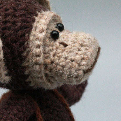 Artisan woven banana primate statuette, juvenile memento, infant gathering adornment, hobbyist display sculpture, Yuletide playroom trim