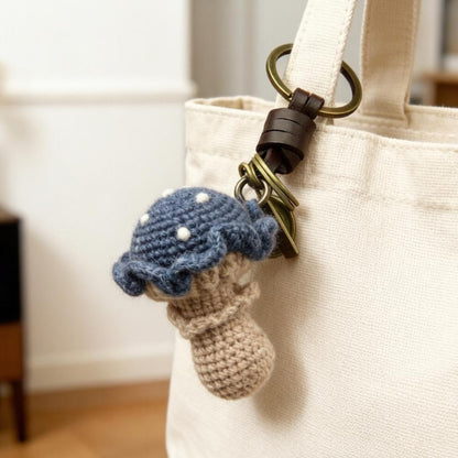 Artisan knit fungus sculptures, imaginative seasonal favors, purse adornments, keyring trinkets, display tokens, Yuletide interior decor