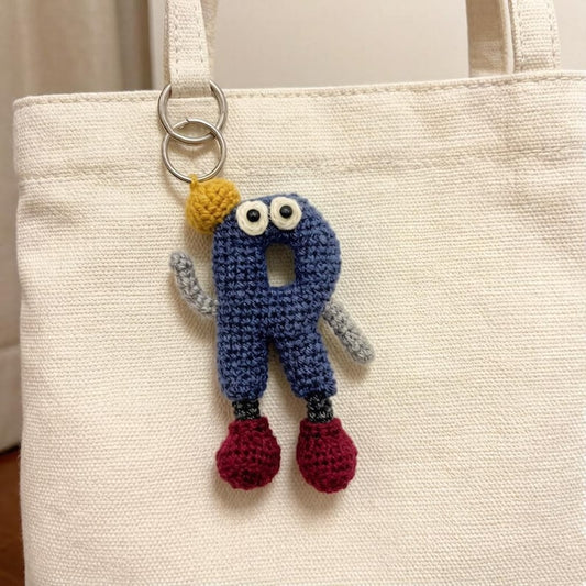 Artisan woven capital R charm, keyring dangling trinket, sack ornamental accent, imaginative gathering memento, Yuletide tote embellishment