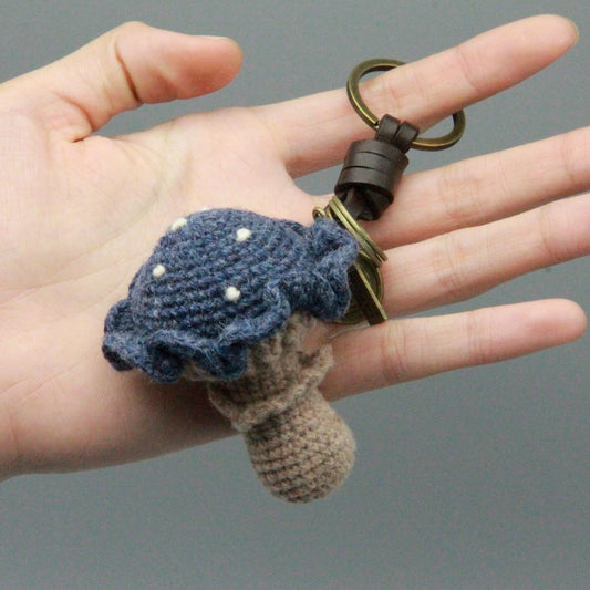 Artisan knit fungus sculptures, imaginative seasonal favors, purse adornments, keyring trinkets, display tokens, Yuletide interior decor